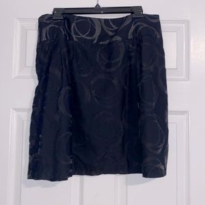 Women’s black skirt with sheer circle pattern. Size 14